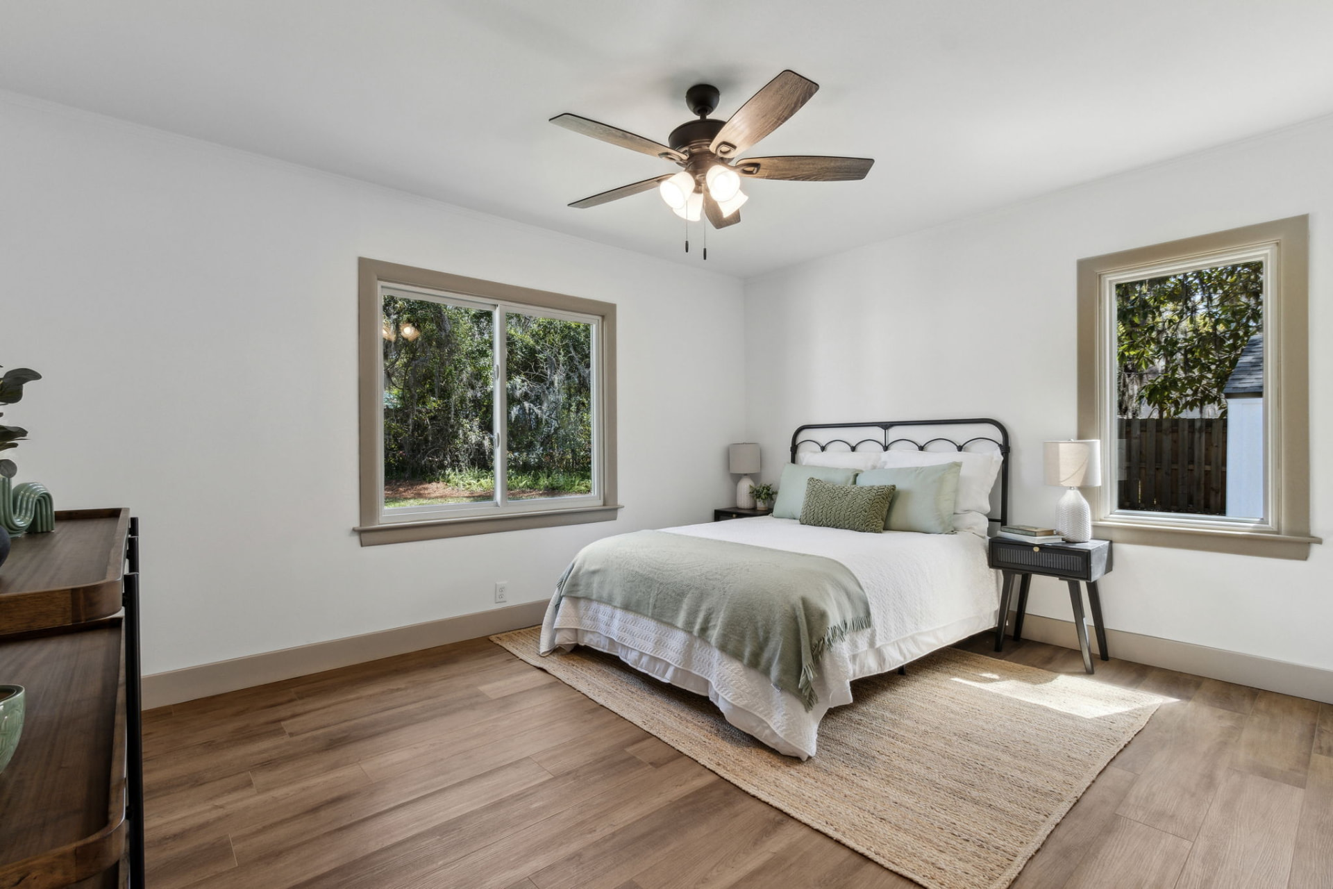 Secondary sitting area styled with neutral furnishings at Oak Grove Place
